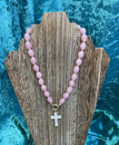 Pink bead necklace with cross